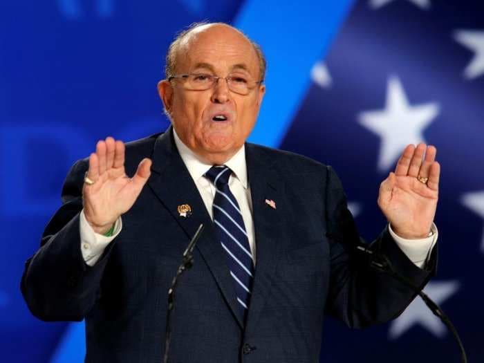 Two of Rudy Giuliani's associates who helped him dig up dirt on Joe Biden have been charged with campaign finance violations