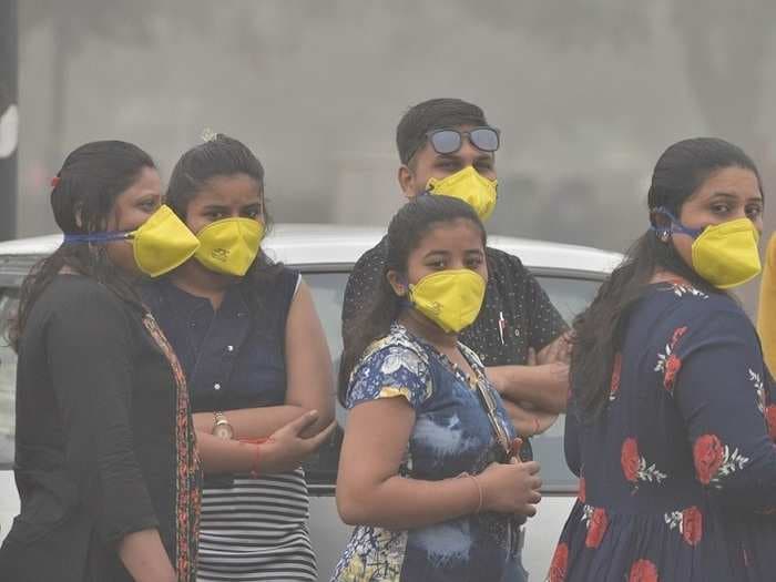 Shocking images of India's national capital Delhi breathing toxic air that is equal to smoking 33 cigarettes a day