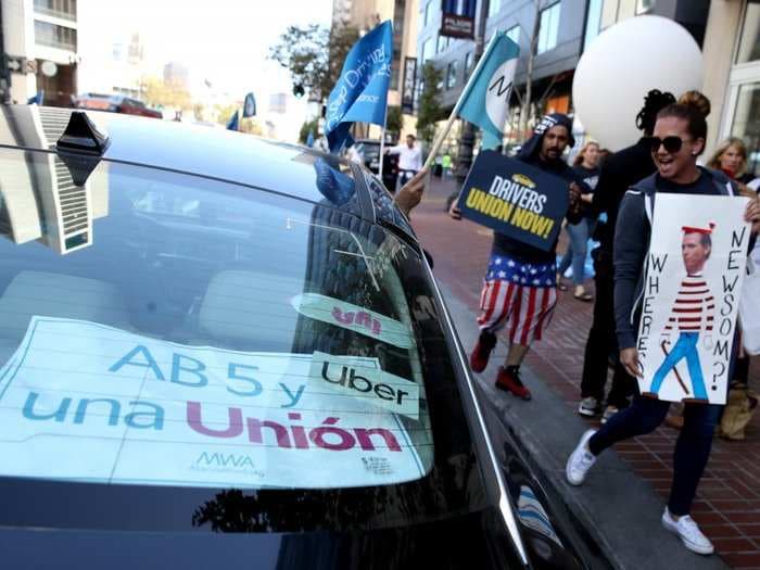 'It feels cold and heartless': Hundreds of California freelancers have been fired before the holidays due to a state law meant to help Uber and Lyft drivers