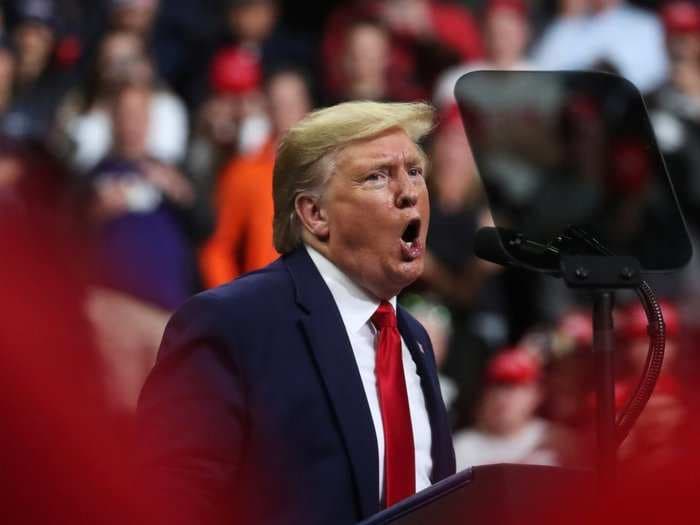 Trump took the stage at a campaign rally in Michigan while the House voted to impeach him: 'It doesn't really feel like we're being impeached'