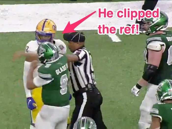 Eastern Michigan quarterback ejected in final minutes of Quick Lane Bowl after throwing punches at Pitt players and hitting a ref