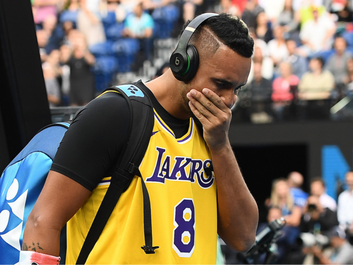 Nick Kyrgios walked into his match against Rafael Nadal wearing a Kobe Bryant jersey, covering his face and holding back tears