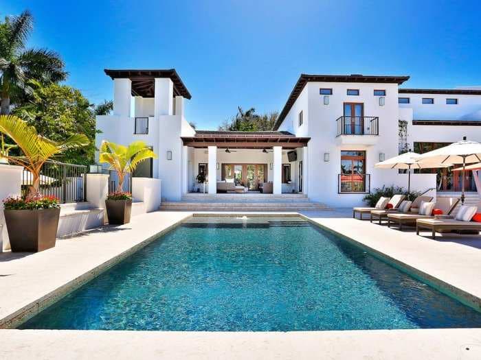 A tech entrepreneur has been trying to offload his Florida mansion for 2 years - and now he's auctioning it off with no minimum price. Look inside the waterfront home last listed for $18 million.