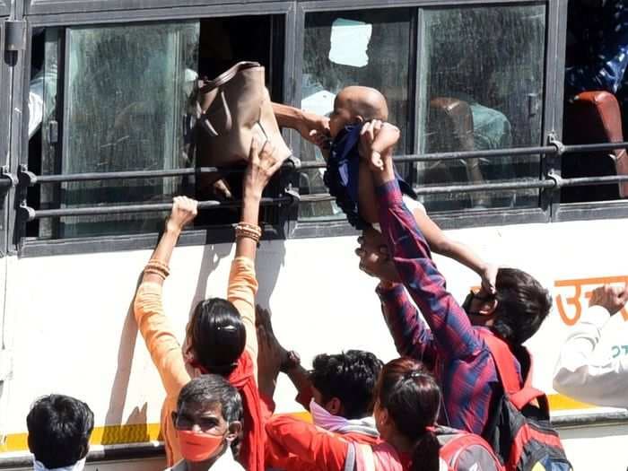 Harrowing pictures show hundreds of thousands of migrant workers flocking to state borders in India despite nationwide lock down