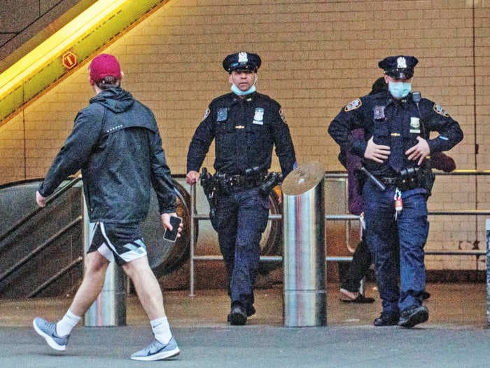 New York City police will force people off crowded subway cars to enforce social distancing, even as trains fill to the brim with essential workers