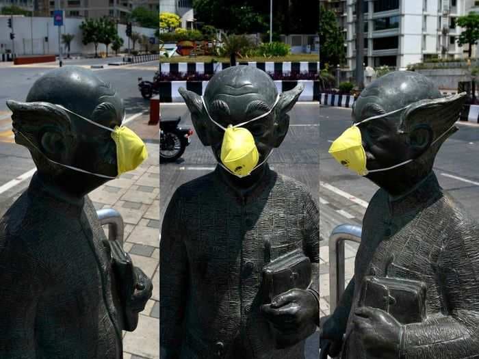India's iconic 'Common Man' wears a facemask in Mumbai to raise awareness around Coronavirus
