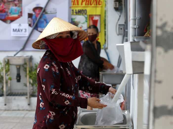 Volunteers in Vietnam set up rice ATMs to provide food for those impacted by the coronavirus