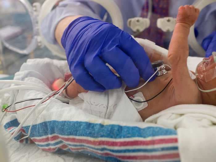 A woman with the coronavirus gave birth while in a coma. She met her newborn when she woke up 11 days later.