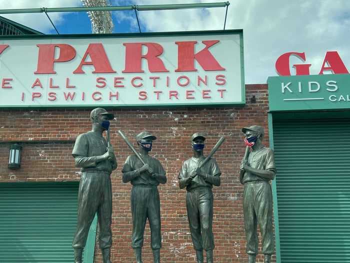 Usually crowded Boston landmarks like Fenway Park and Faneuil Hall cut a stark figure as they are deserted amid the coronavirus pandemic lockdown