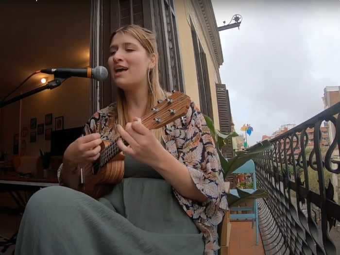 A Canadian woman self-isolating in Spain has been singing to her neighbors from her balcony every day