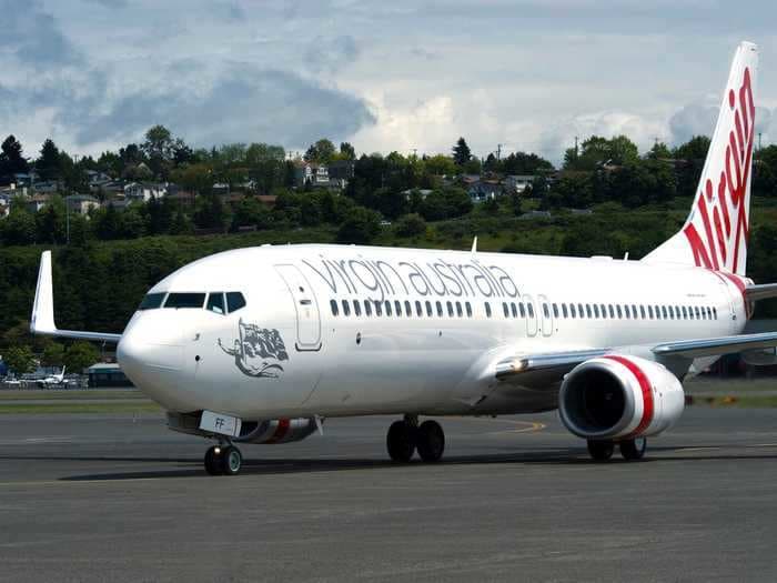 Perth Airport has resorted to blocking Virgin Australia planes with a bulldozer in an attempt to get the airline to pay its debt