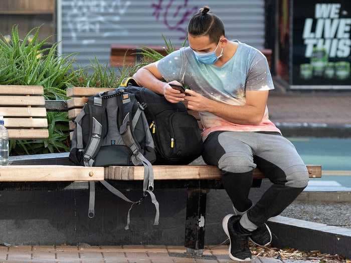 Photos show New Zealand residents getting back to the beach, the putting green, and the McDonald's drive-thru line after more than a month in coronavirus lockdown