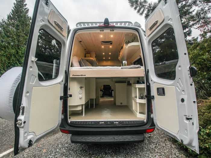 This $90,000 camper van conversion was built on a Mercedes-Benz Sprinter for a woman to travel with her 4 dogs — see inside 'Pluto'