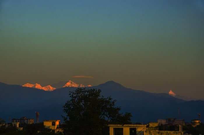 The snowy peak of Kanchenjunga can now be seen from a 100 km away because the slump in global energy demand has cleared the skies