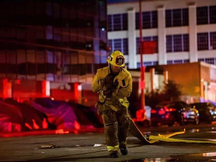 A massive explosion in a hash oil manufacturing company leaves Los Angeles 11 firefighters injured after they had to run through a 30-foot high wall of fire