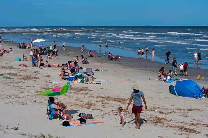 You probably won't catch the coronavirus from swimming. It's the crowds on the beach that matter.