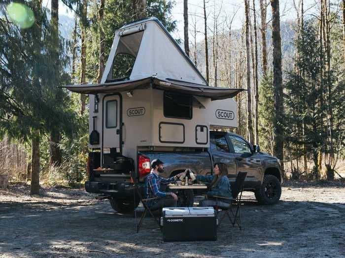 This $19,980 camper is mounted on top of a pickup truck and can sleep up to 6 people — see inside