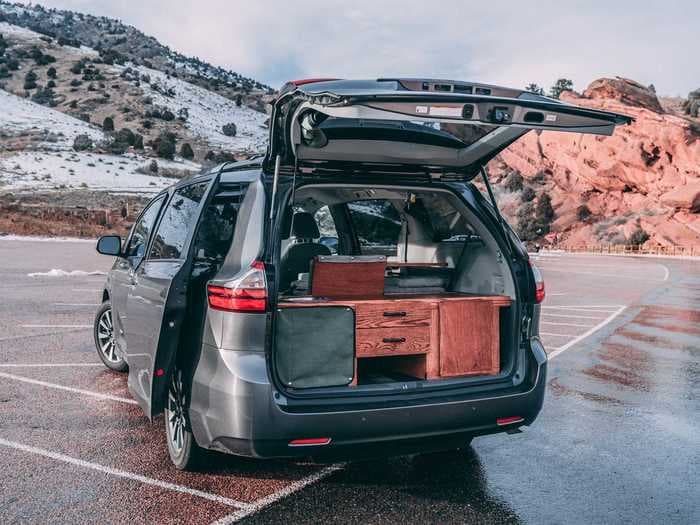 This 2018 Toyota Sienna minivan was turned into a camper van with a kitchen, living room, and bedroom for $8,500 — see how