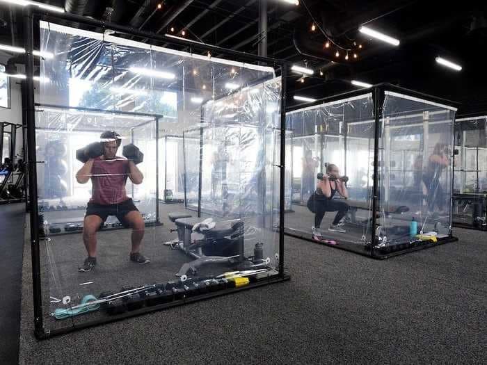 A California gym reopens with bizarre looking plastic workout pods to enable customers to exercise in groups and maintain social distancing