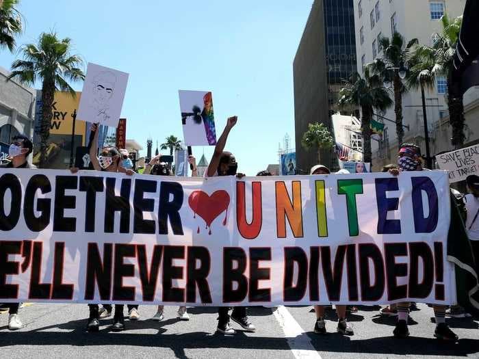 18 photos show how Pride and Black Lives Matter supporters are rallying together for change