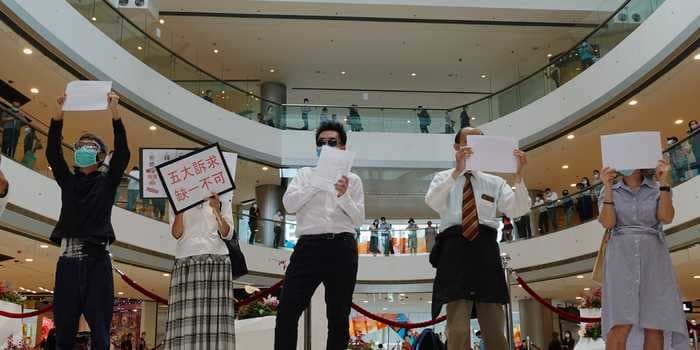 Hong Kong activists are holding up blank signs because China now has the power to define pro-democracy slogans as terrorism