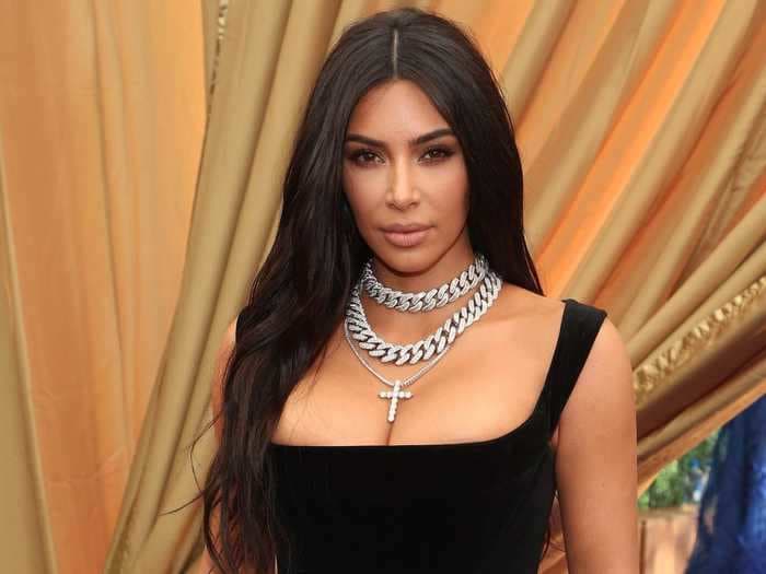 Kim Kardashian wore a $135 lavender crop top with a pair of black leather chaps