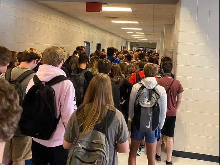 Students say they were suspended and others threatened with 'consequences' for posting photos of their school's packed hallways