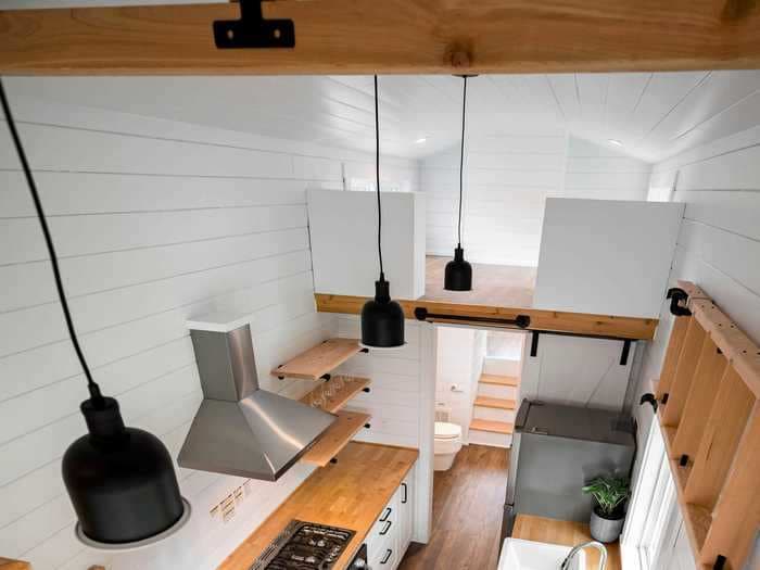 This tiny home on wheels has four rooms and two lofts but can still be towed with a pickup truck — see inside the $111,300 Traveler's Paradise