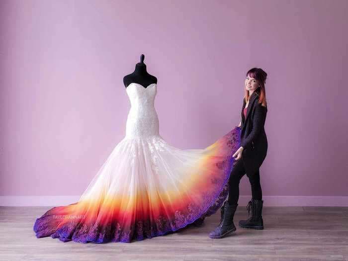 An artist airbrushes wedding dresses, and you can buy one of her colorful creations for your special day