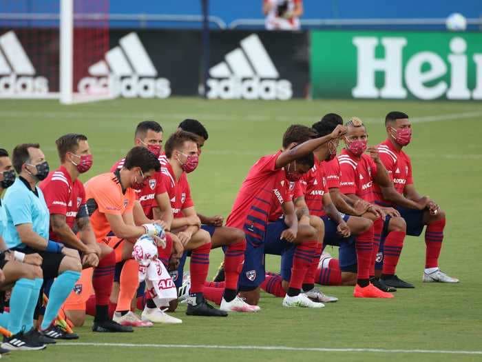 FC Dallas fans booed players who knelt for the national anthem in solidarity with Black Lives Matter, and the team's defender called them 'absolutely disgusting'