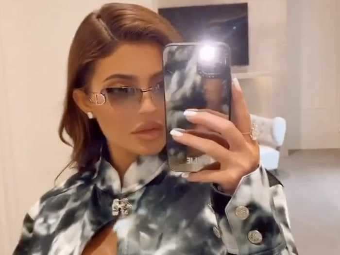 Kylie Jenner took the tie-dye trend to the next level in a 3-piece set that included a top held together by tiny strings