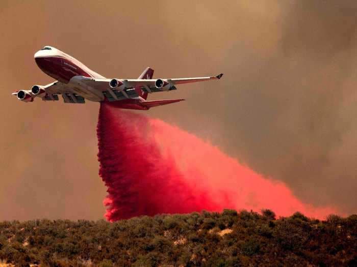 Retired passenger airliners are getting a second life fighting fires as iconic jets are repurposed as water bombers  – take a look