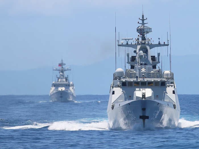 China fires two missiles into the South China Sea and Asian markets feel the blow