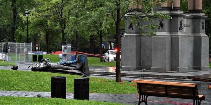 Activists tear down a statue of Canada's first prime minister, whose policies towards Indigenous people were later declared 'cultural genocide'