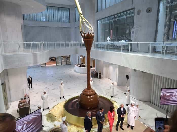 The world's largest chocolate fountain pours from 30 feet high into a giant Lindor at a new Lindt shop in Switzerland