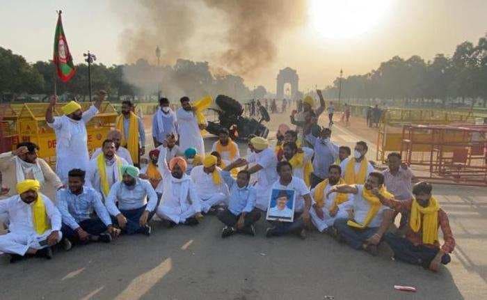 Farmers protest against three farm bills turn violent after protestors set a tractor on fire near India Gate