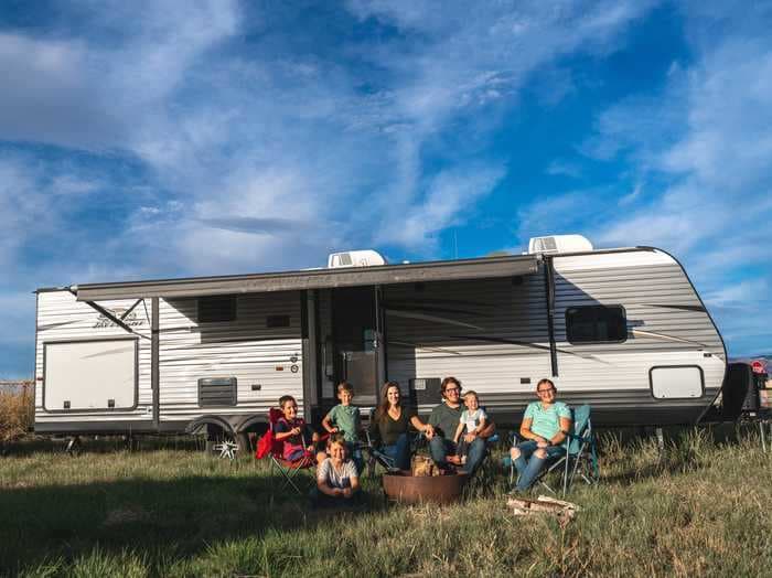 A couple lives with their 5 kids in a 300-square-foot RV while running a business turning trailers into beautiful tiny homes on wheels