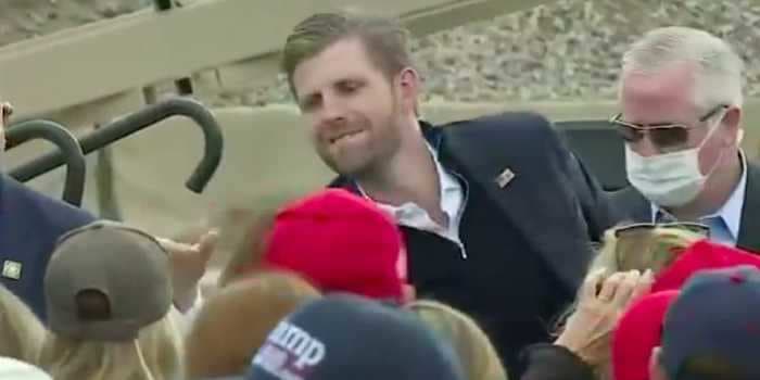 A maskless Eric Trump was filmed high-fiving and shaking hands with Trump supporters in Michigan where coronavirus cases just hit a new high