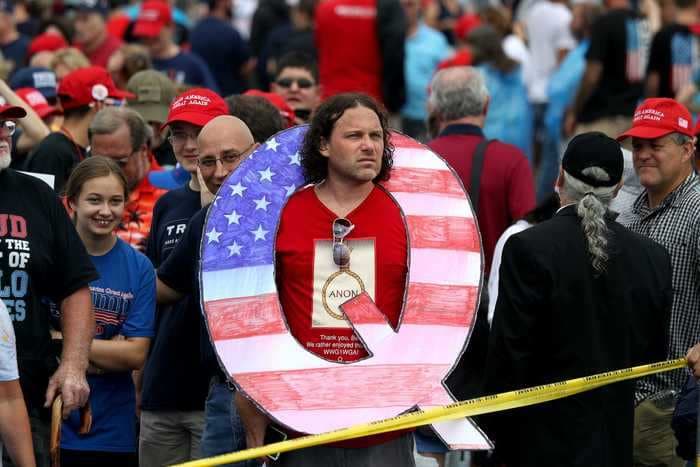 Facebook paused efforts to redirect QAnon searches to fact-checks after a glitch showed people information about the conspiracy theory even when they weren't looking for it