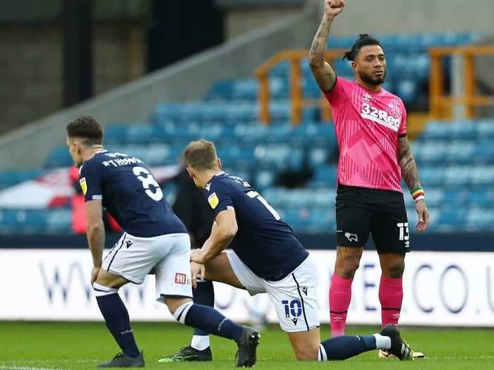 English soccer fans jeered players who took a knee in support of Black Lives Matter at the first match with supporters since pandemic