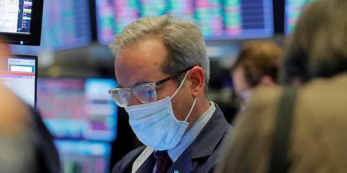 US stocks hover near record highs as investors look to Congress for final stimulus approval