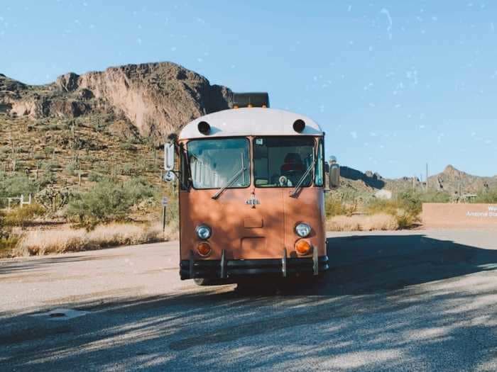 A couple and their dog live full-time in a 298-square-foot bus they transformed into their mid-century modern dream home on wheels