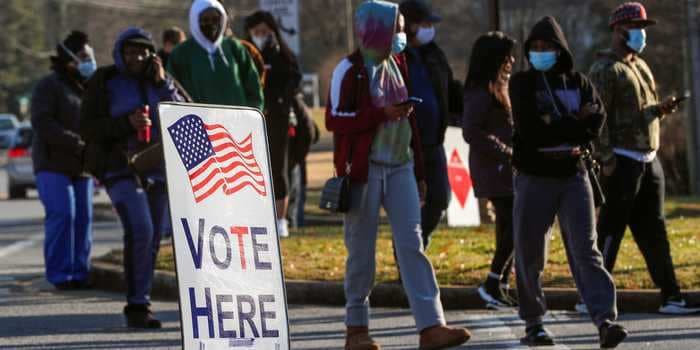 Dow climbs 200 points as investors await Georgia run-off election results