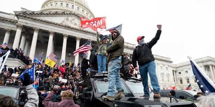 Dow closes at record as Democratic Senate win and stimulus expectations offset Capitol chaos