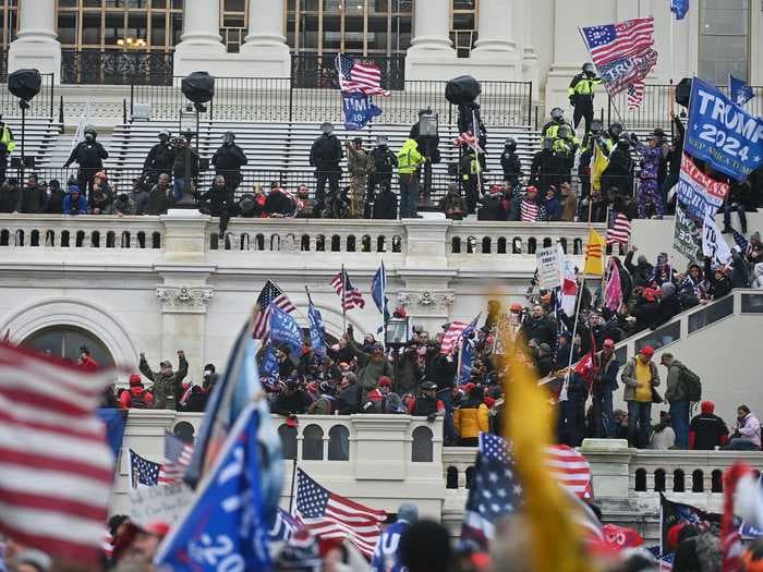 Social media users are slamming a Hyatt hotel in Washington, DC, after a video surfaces showing Trump supporters parading around the hotel without masks