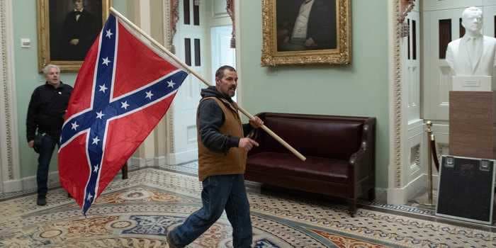 The FBI arrested the man seen with a Confederate flag inside of the US Capitol