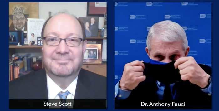 Watch Fauci demonstrate how he wears 2 masks to make them 'more firm and comfortable'
