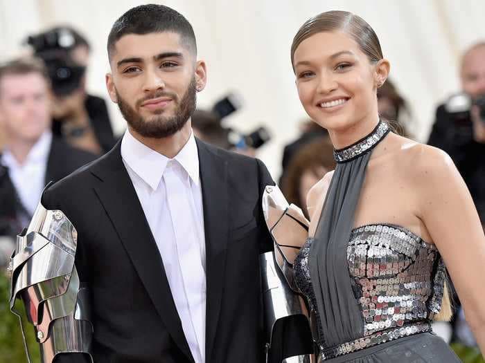 Gigi Hadid says she didn't know her natural 14-hour home birth was over until Zayn Malik caught their daughter in his arms