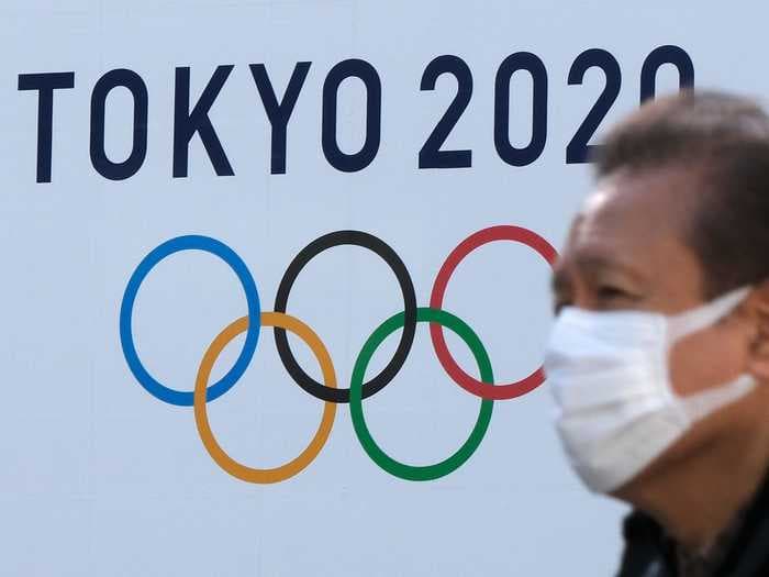 Olympic organizers say they'll hand out 150,000 free condoms but want athletes to stay 6 feet away from one another - and the internet is having a field day over the contradiction