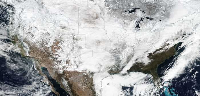 These satellite images show almost the entire US covered in snow